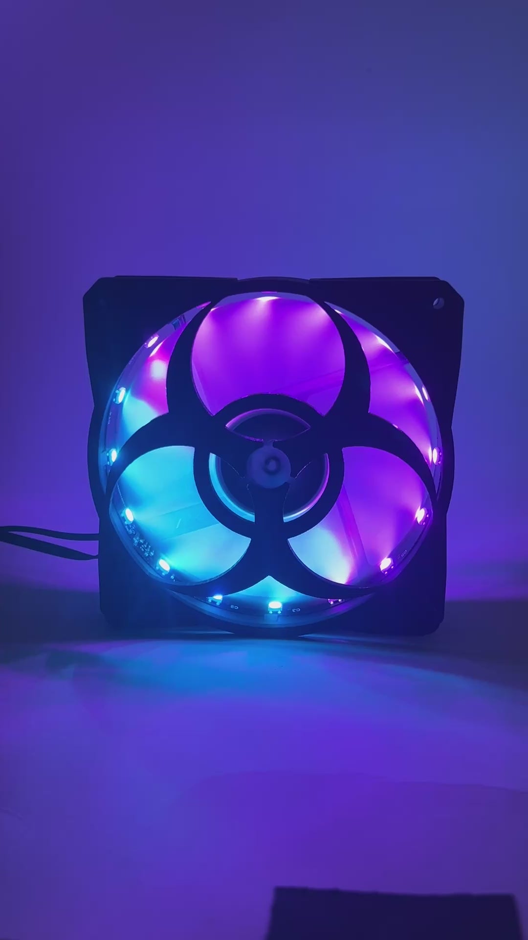3D printed PC fan grill featuring a bold biohazard symbol. Perfect for custom gaming rigs, PC case mods, and fans of edgy, nerdy, or horror-inspired builds.