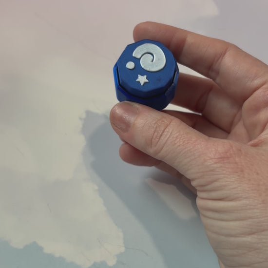 Blue animal crossing fossil themed fidget clicker with white design.