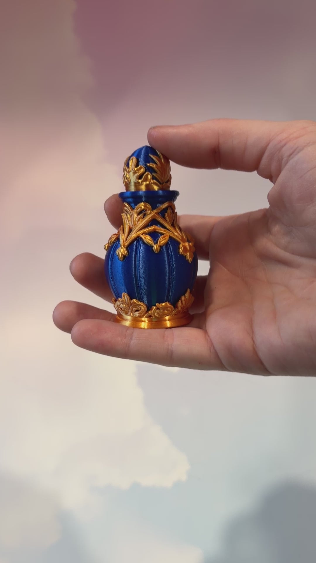 Royal blue and gold 3D printed potion bottle fidget clicker with ornate fantasy details, available in clicky or silent versions.