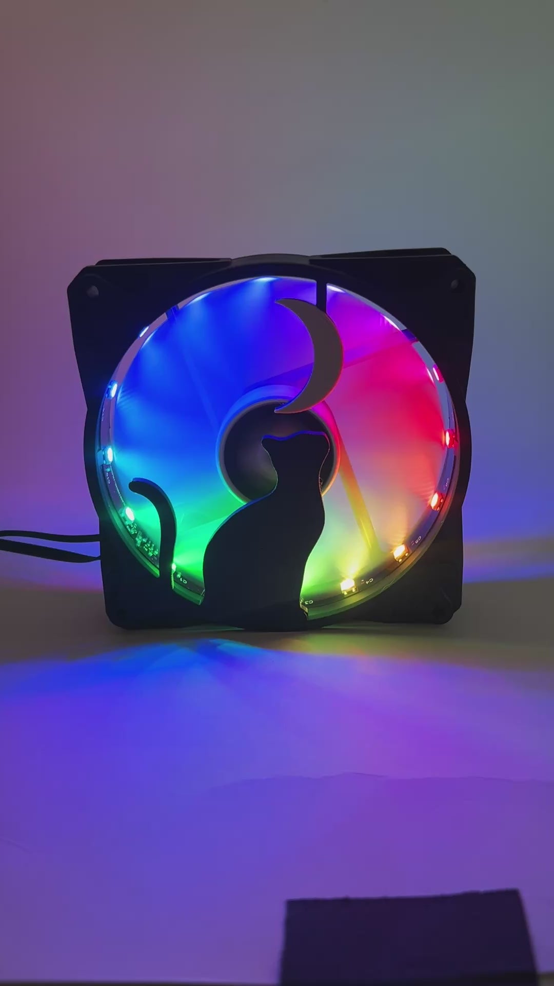 3D printed PC fan grill with a silhouette of a cat gazing at the moon. Perfect for whimsical gaming setups and cat lovers who love custom tech.