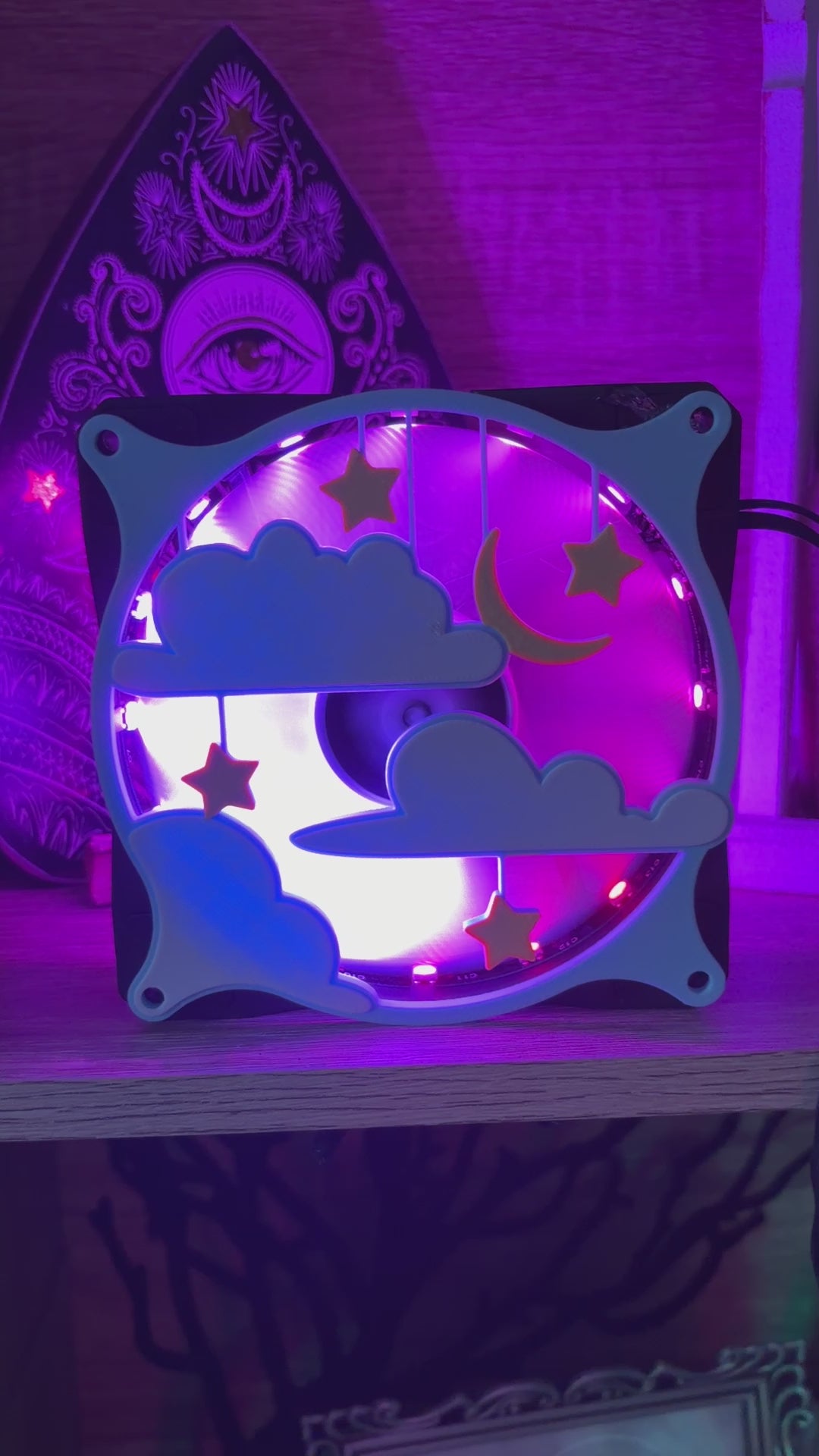 A 120mm PC fan grill featuring hanging clouds and stars.