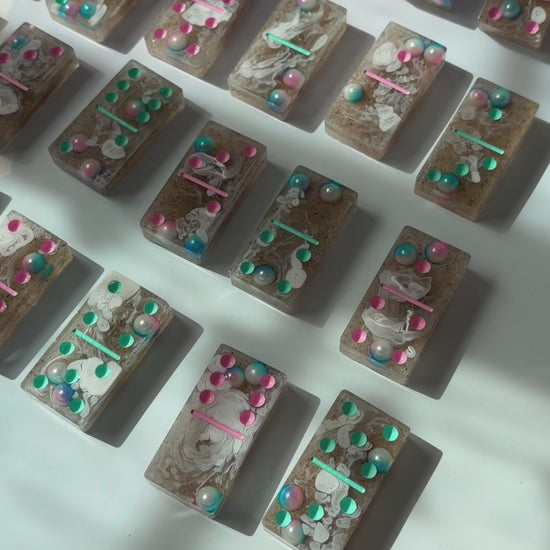 Handmade seashore resin dominoes with pearls and sand.