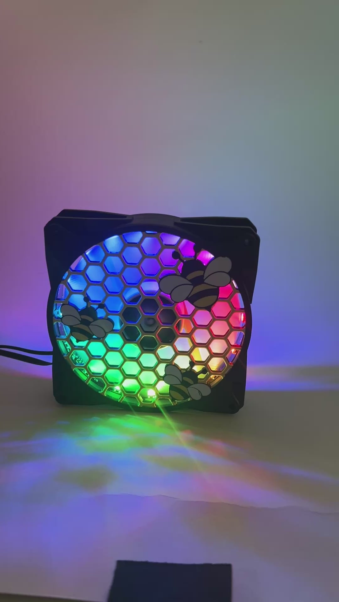 Adorable 3D printed PC fan grill featuring bees and honeycomb. Perfect for customizing aesthetic gamer setups with a cute, nature-inspired design.