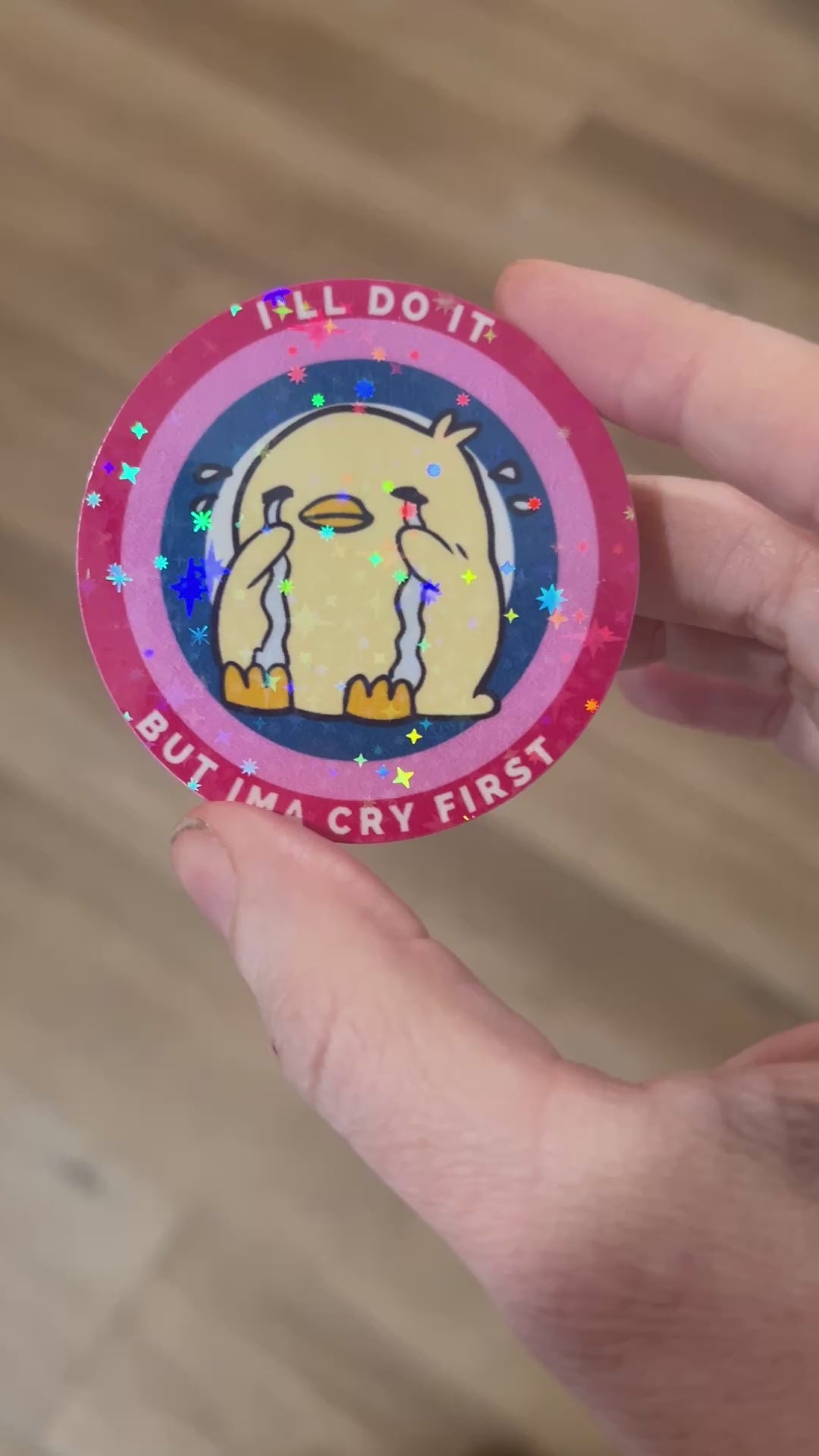 Cute holographic vinyl sticker of a cartoon duck with tears and the phrase “I’ll Do It But I’mma Cry First,” perfect for laptops, water bottles, and journals.