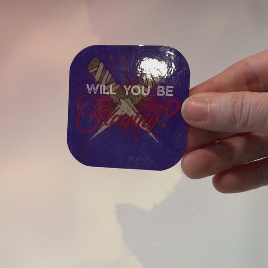 Vinyl sticker featuring two crossed wooden stakes with the phrase "Will You Be Slaying?" in a gothic romance design, weather and water resistant.