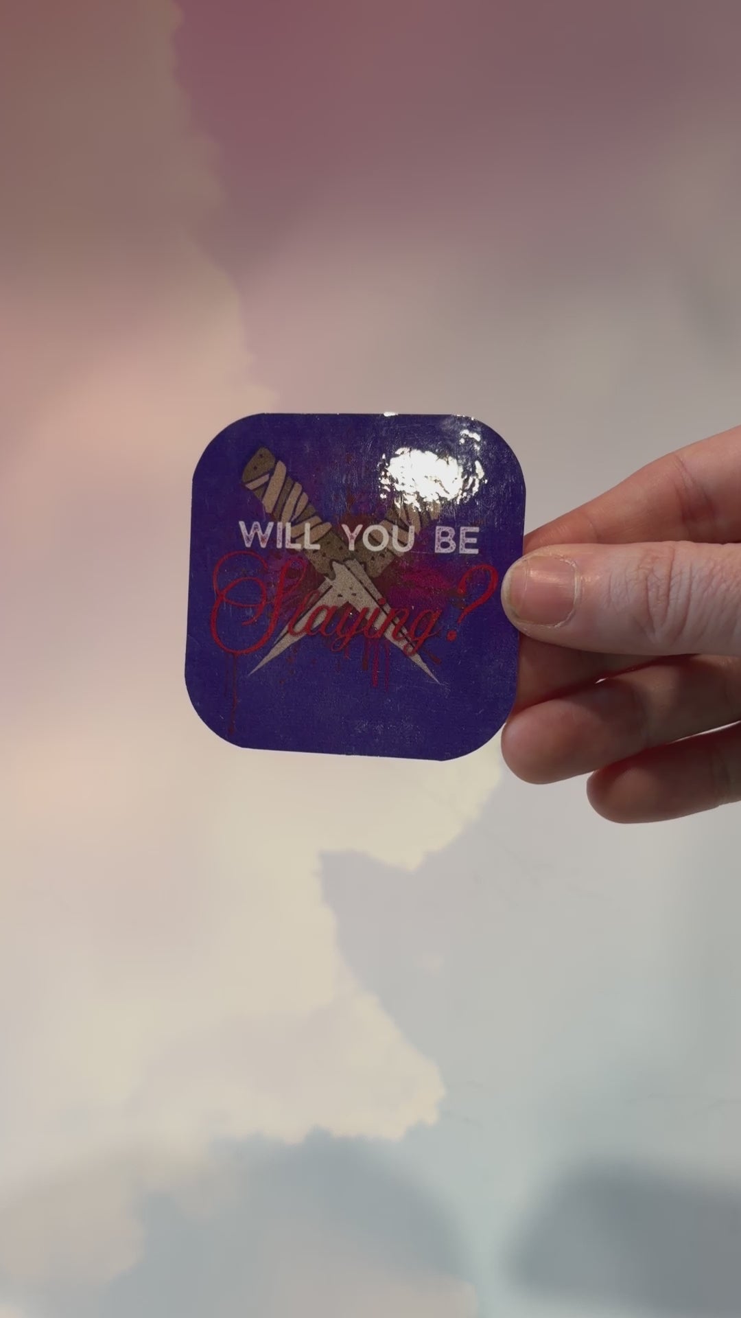 Vinyl sticker featuring two crossed wooden stakes with the phrase "Will You Be Slaying?" in a gothic romance design, weather and water resistant.