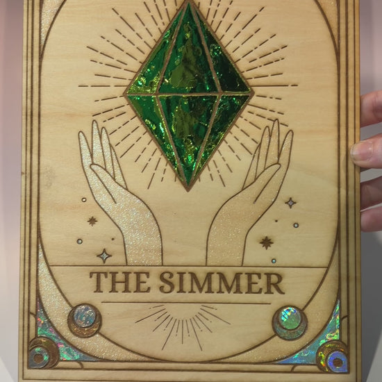 Large laser engraved wooden tarot card featuring a colorful Sims-inspired plumbob with holographic gold and silver foil accents.