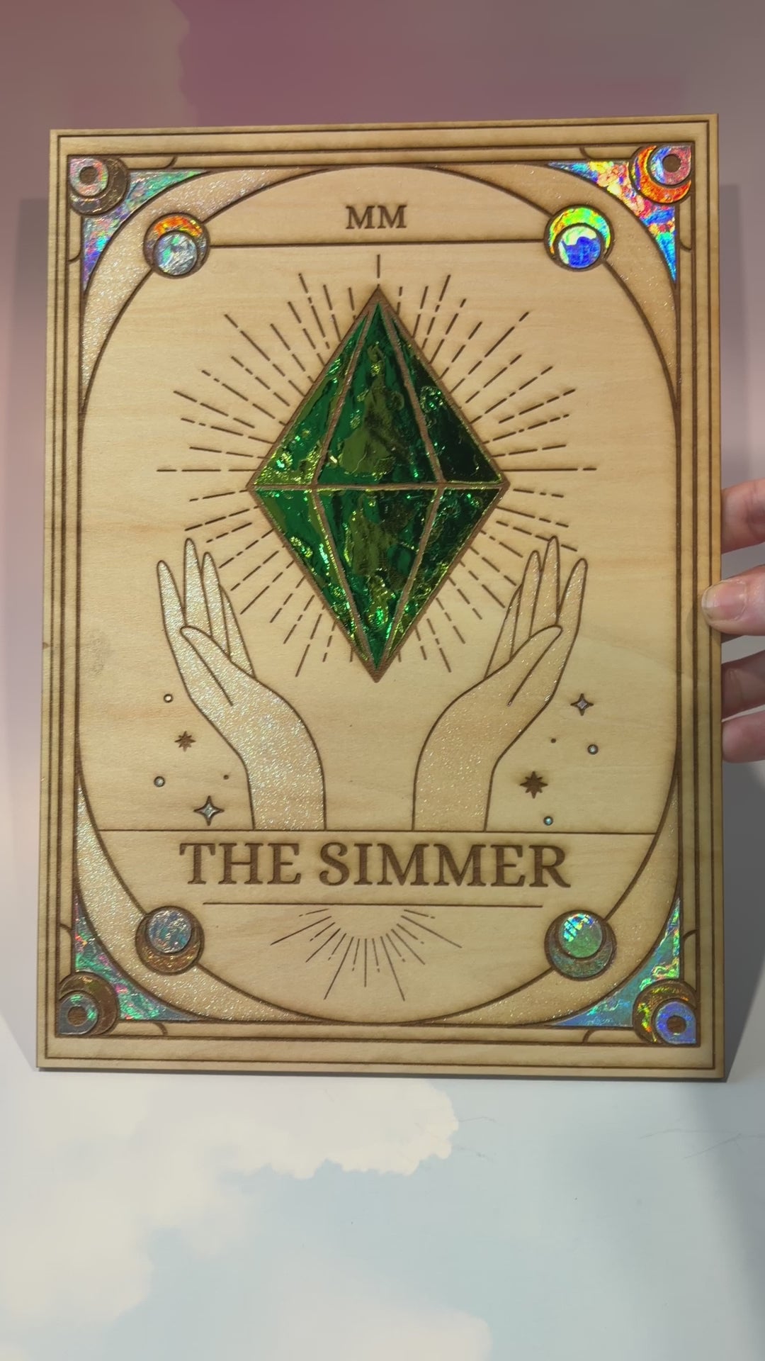 Large laser engraved wooden tarot card featuring a colorful Sims-inspired plumbob with holographic gold and silver foil accents.