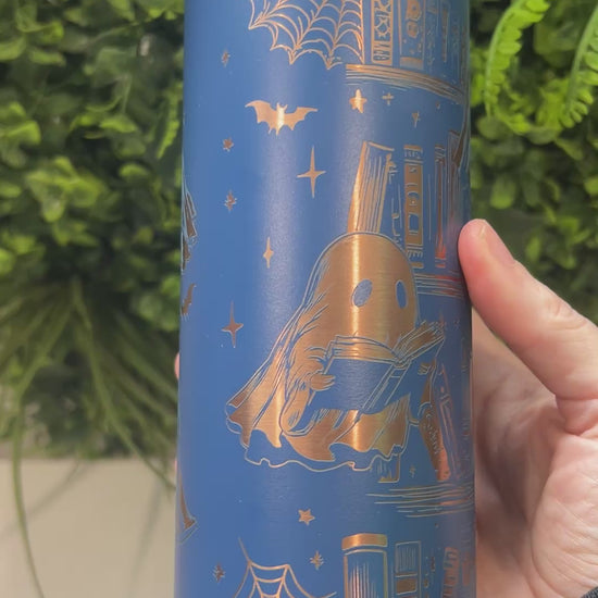 20oz laser engraved skinny tumbler featuring Halloween books, ghosts, bats, and spiderwebs. Perfect spooky drinkware for witchy book lovers and gothic décor fans.