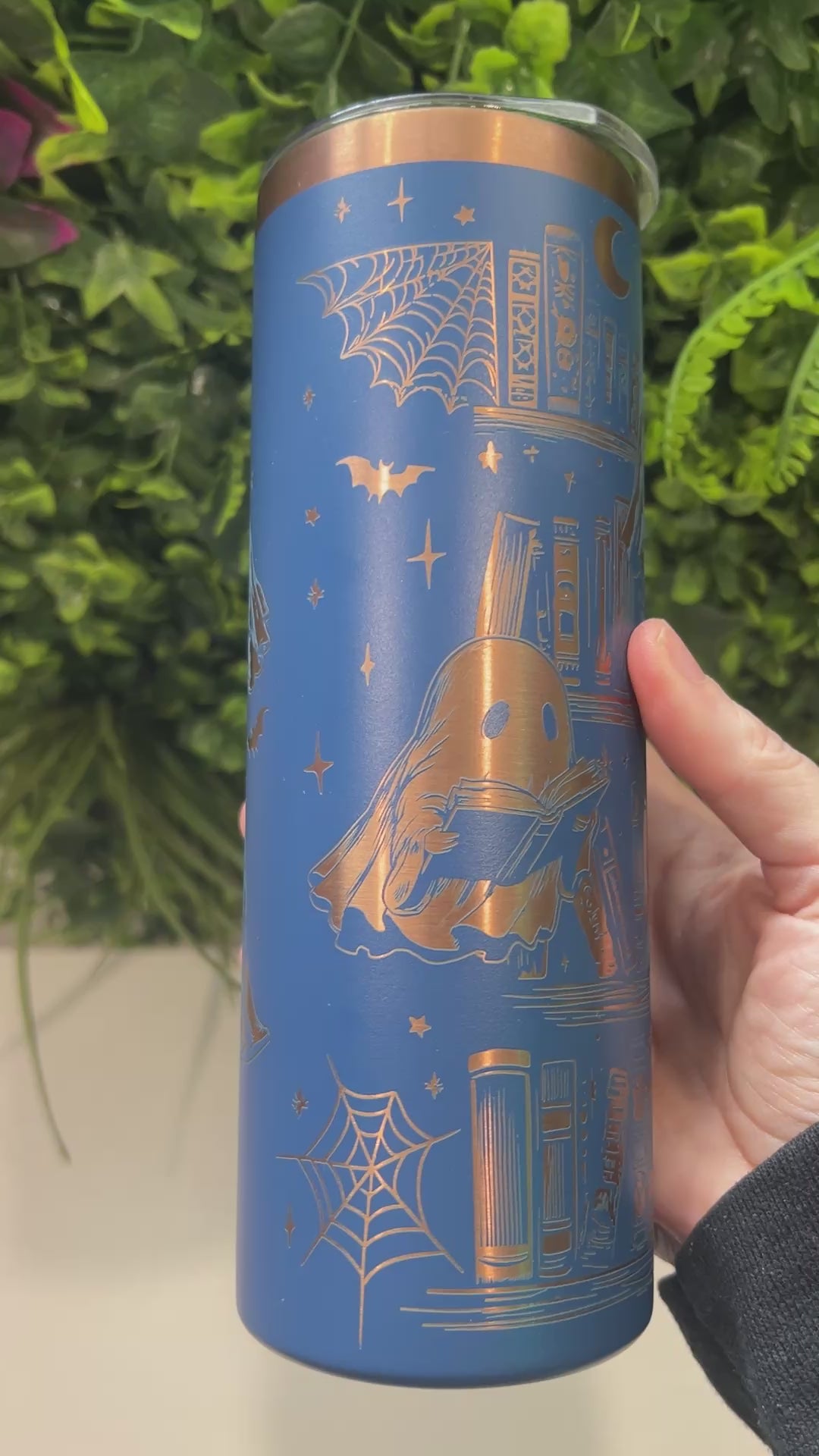 20oz laser engraved skinny tumbler featuring Halloween books, ghosts, bats, and spiderwebs. Perfect spooky drinkware for witchy book lovers and gothic décor fans.