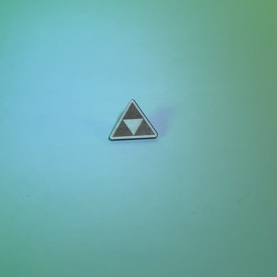 Laser engraved wood pin featuring the iconic Triforce symbol from Zelda. A handmade accessory perfect for gamers, fantasy lovers, and geeky gift collectors.