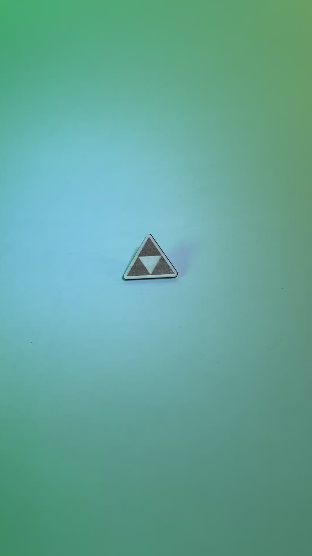 Laser engraved wood pin featuring the iconic Triforce symbol from Zelda. A handmade accessory perfect for gamers, fantasy lovers, and geeky gift collectors.