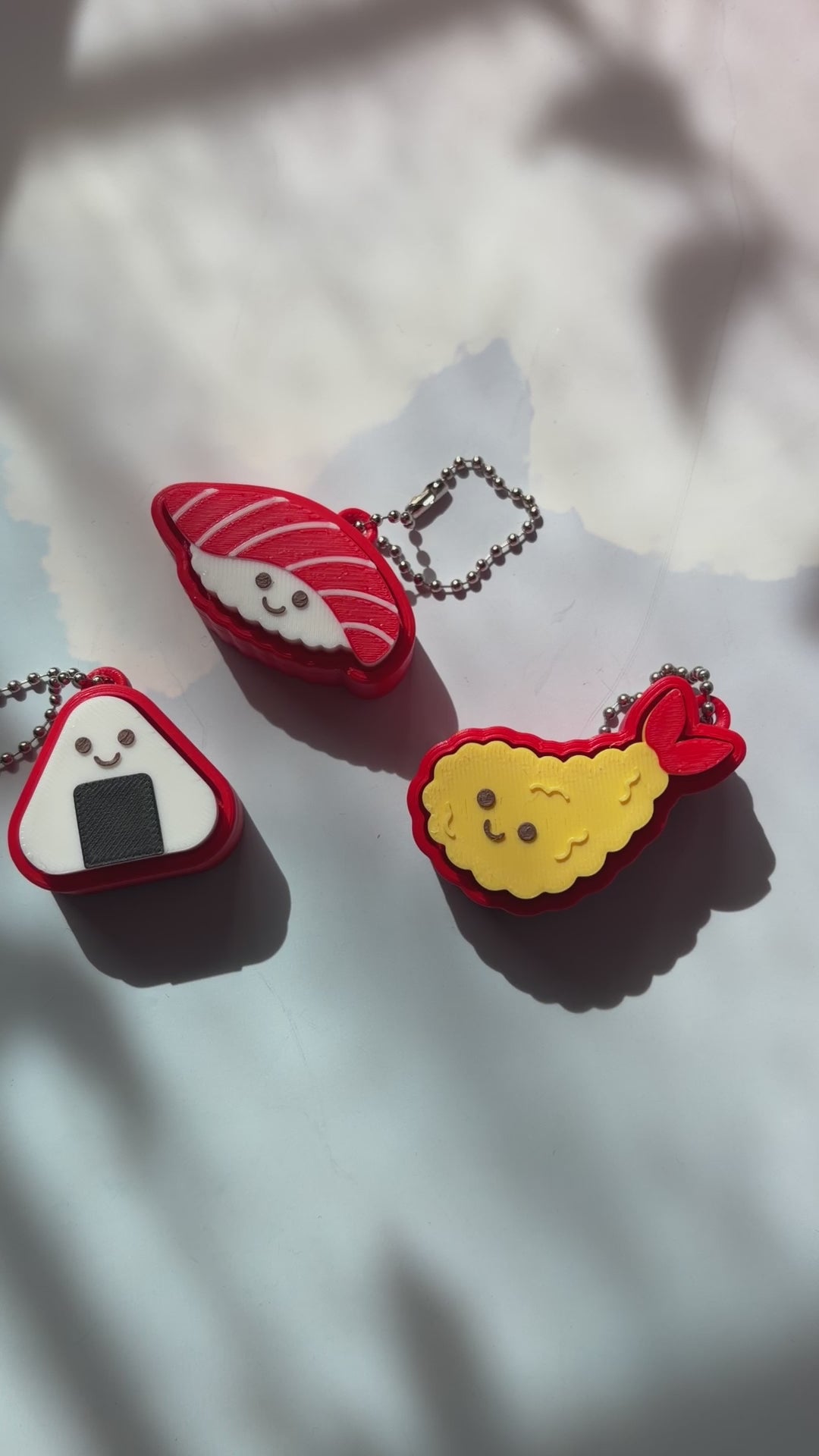 Sushi shaped 3D printed fidget clicker keychain. 