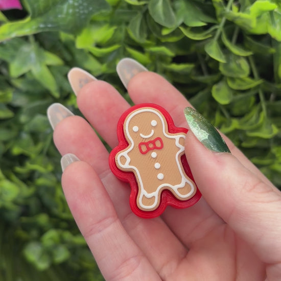 Holiday gingerbread fidget clicker toy.