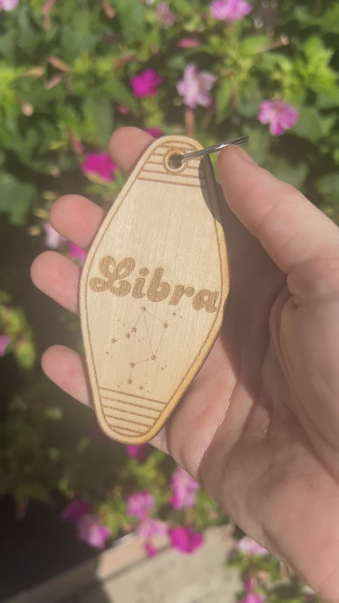 Laser engraved wood motel keychain featuring zodiac names and constellations, perfect for astrology lovers, horoscope fans, and retro gift collectors.