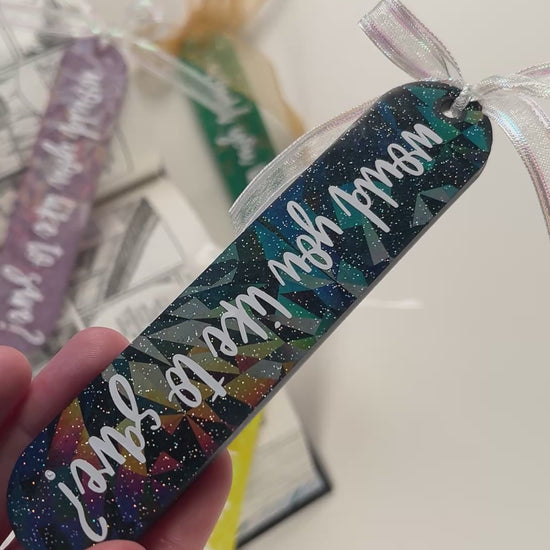 Handmade resin bookmark for gamers featuring 'Would you like to save?' design, vibrant colors, and glittery details. Perfect gift for RPG fans.