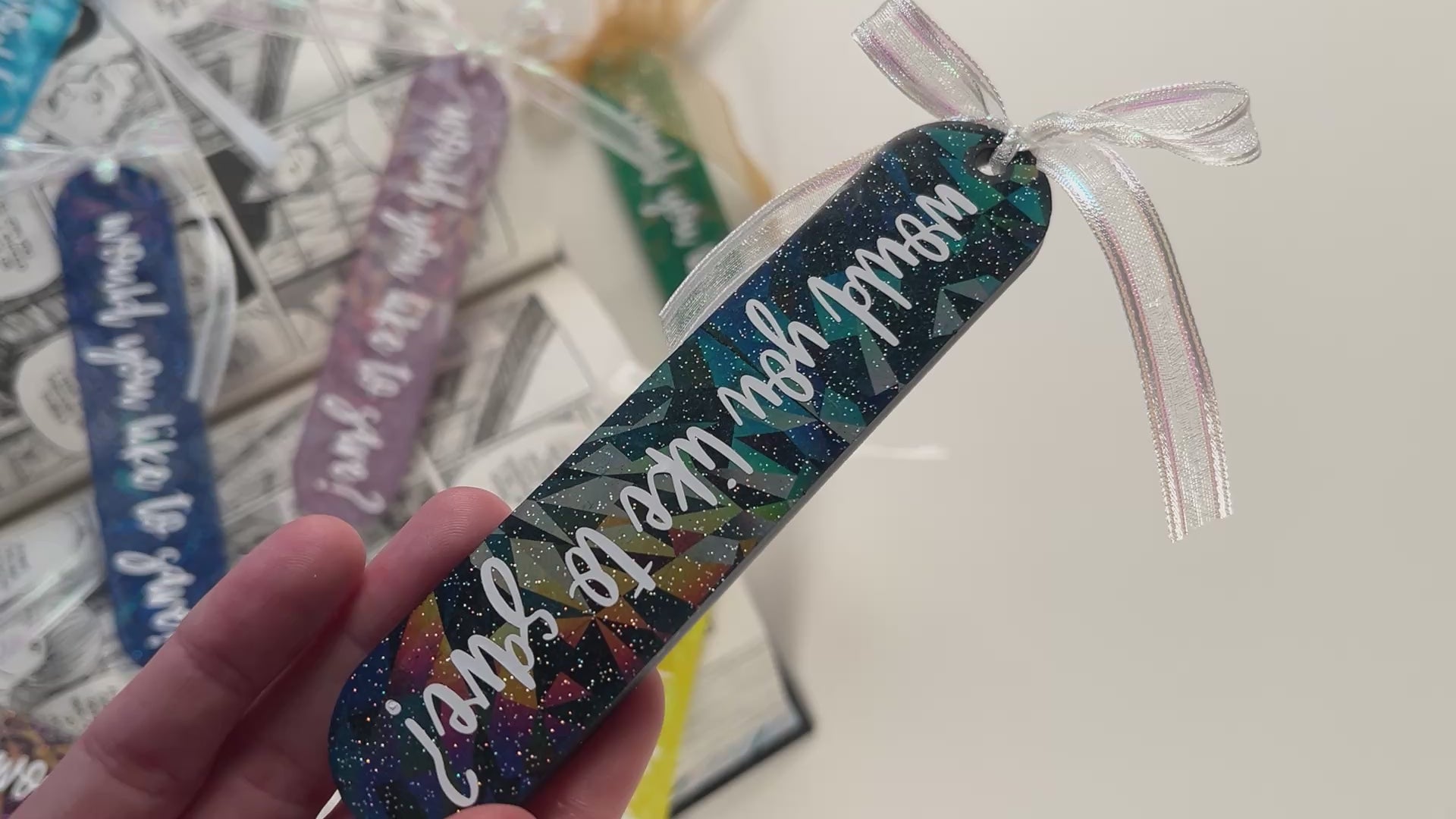 Handmade resin bookmark for gamers featuring 'Would you like to save?' design, vibrant colors, and glittery details. Perfect gift for RPG fans.