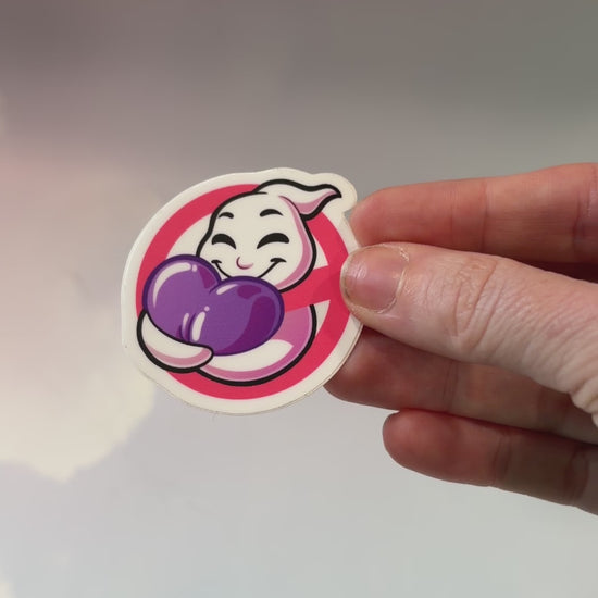 A vinyl sticker featuring a playful ghost hugging a purple heart, inspired by Ghostbusters. Perfect for laptops, water bottles, and notebooks.