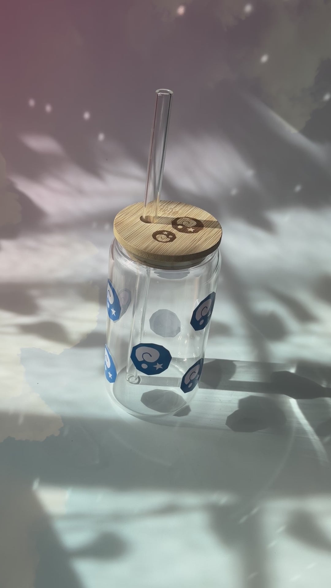 Glass tumbler with bamboo lid featuring Animal Crossing inspired fossil designs.