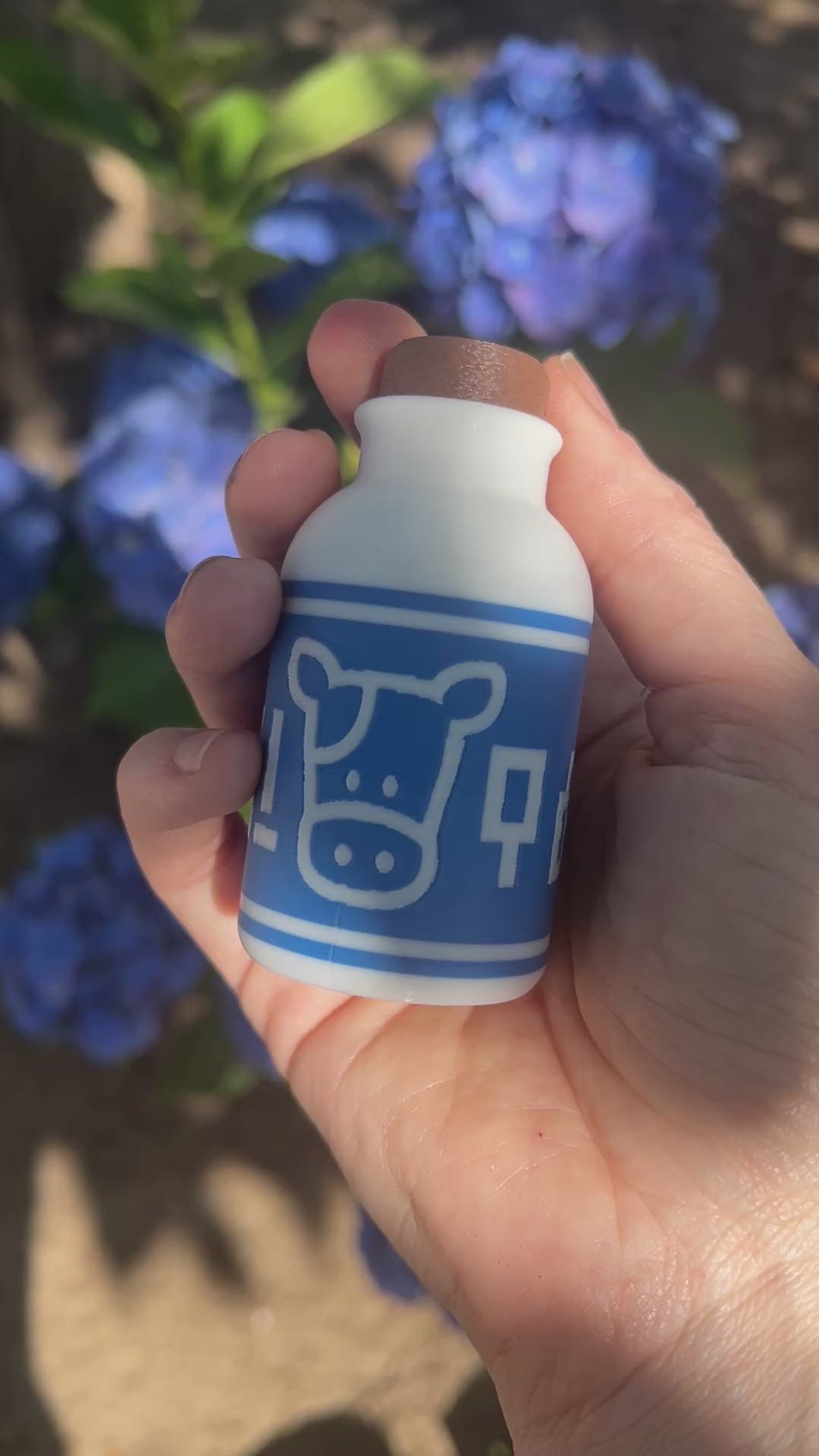 A cute Lon Lon Milk Bottle clicker toy inspired by classic games. 3D printed and handheld, great for fidgeting, gifting, or gamer-themed keychains.