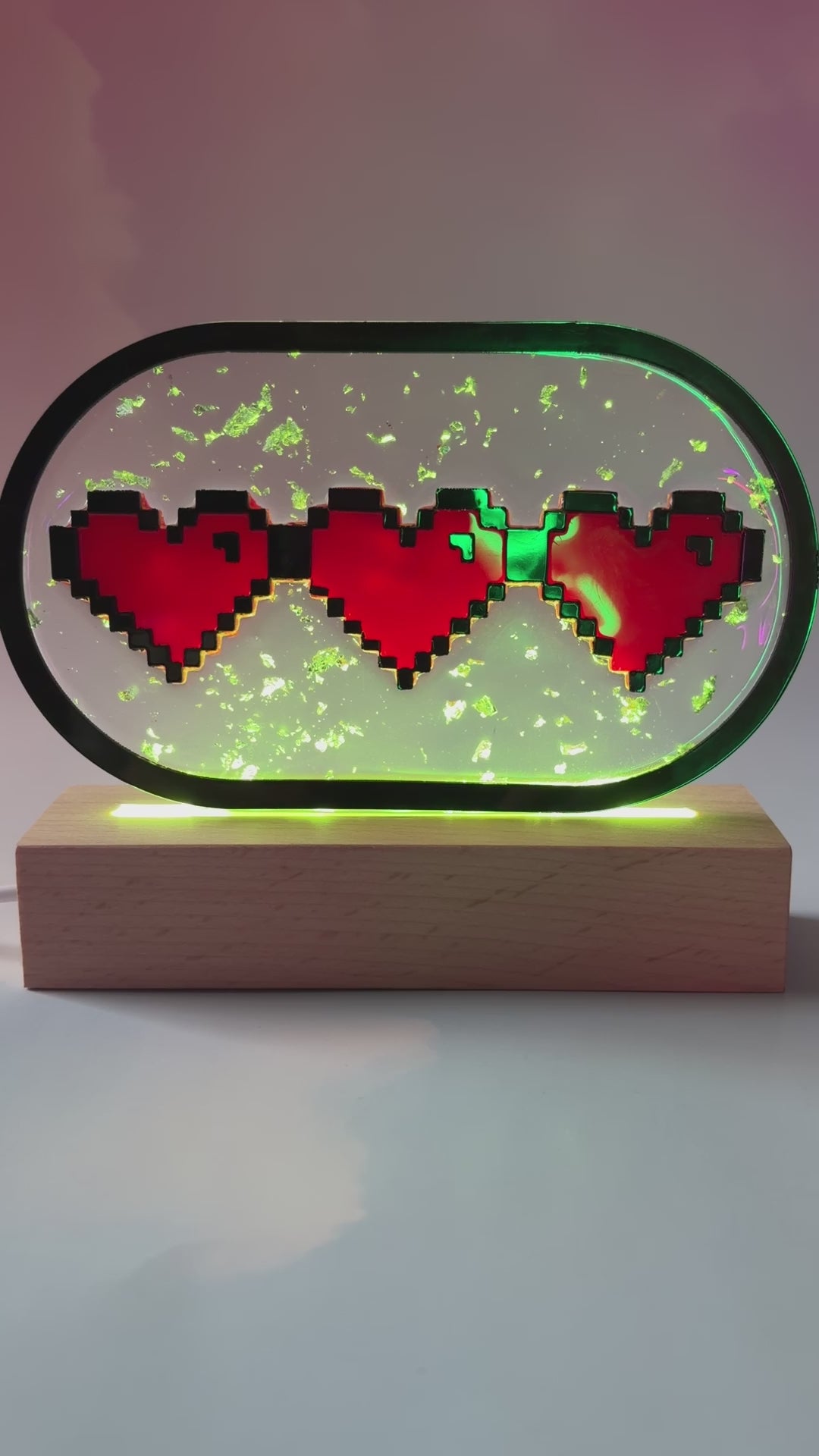 Handmade LED pixel heart container light with a hand-poured resin panel, silver leaf accents, laser-cut acrylic hearts, and customizable RGB lighting.