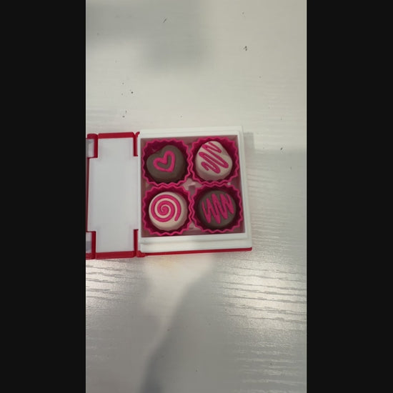 Valentine themed book fidget clicker with chocolate box interior.
