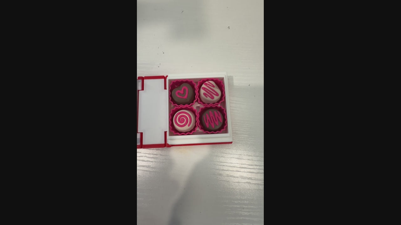 Valentine themed book fidget clicker with chocolate box interior.