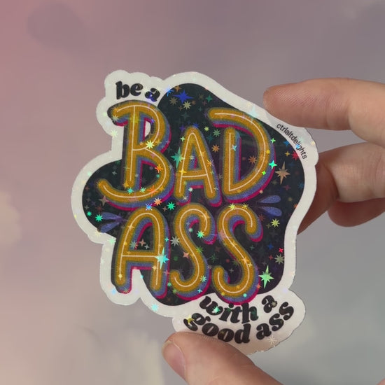 This vibrant vinyl sticker with the phrase 'Be a Badass with a Good Ass' is perfect for adding motivational flair to your laptop, water bottle, or journal. The playful yet bold design is sure to inspire confidence wherever you place it.