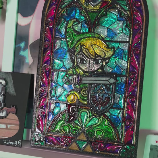 Handmade Zelda-inspired stained glass window light featuring hand-tinted resin artwork in a 3D printed frame with glowing interior LED lighting.
