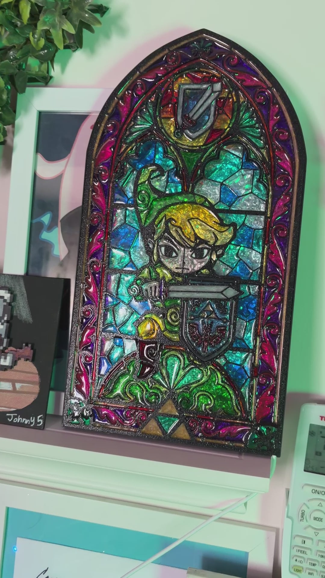 Handmade Zelda-inspired stained glass window light featuring hand-tinted resin artwork in a 3D printed frame with glowing interior LED lighting.